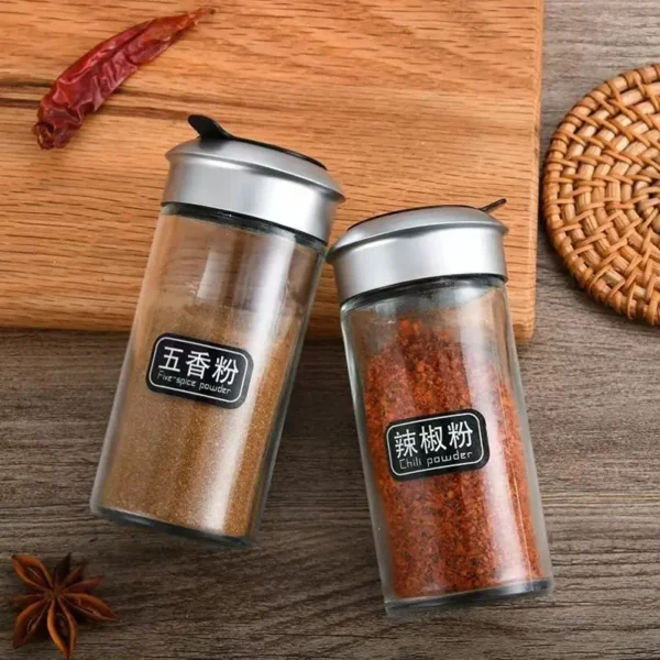 Hfbb2da3a8c3e49a281a6612cb96d27bbc.webp Dropshipping Glass Spice Bottles with Plastic Lids Rotating Multi-hole Shakers Pepper/salt Wholesale Kitchen Supplies in Stock